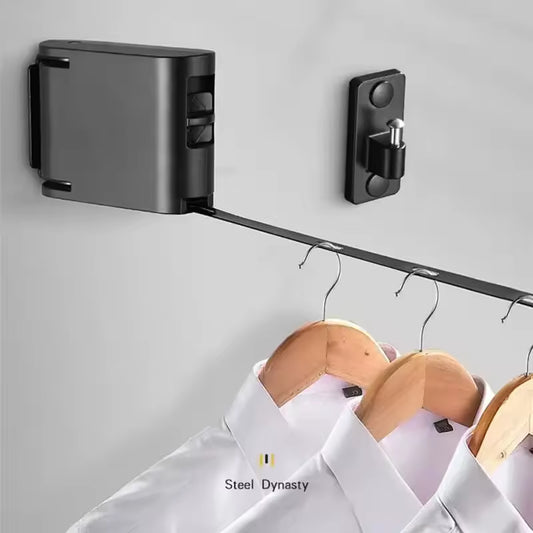 Clarify.pk retractable clothesline in black with three wooden hangers holding white shirts
