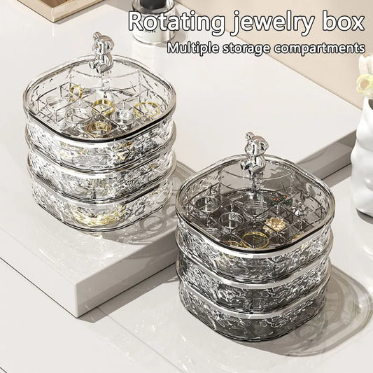 Clarify.pk rotating high-end jewelry storage box with multiple clear compartments for organizing rings and earrings
