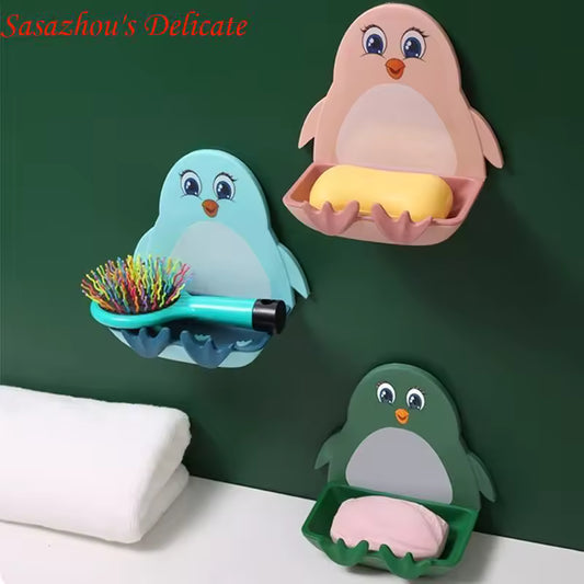 Colorful penguin soap holder wall mount set with yellow and pink soap on green bathroom wall