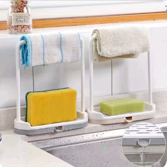 White dual sponge holder for sink with towel bar and draining tray holds sponge and cloth for kitchen cleanup