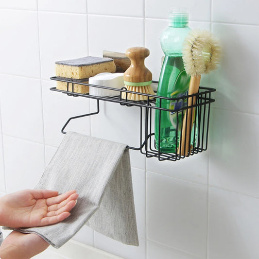 Clarify.pk black metal sink shelf organizer holding brushes, sponges, and dish soap with hanging towel
