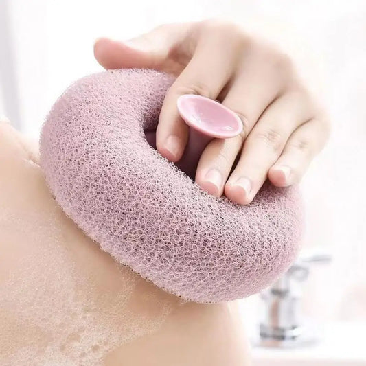 Clarify.pk soft bath brush for exfoliating in pink mesh design being used on shoulder