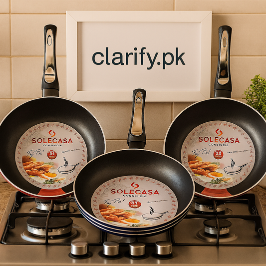Set of three Solecasa non stick frying pans with black handles on a stove by Clarify.pk