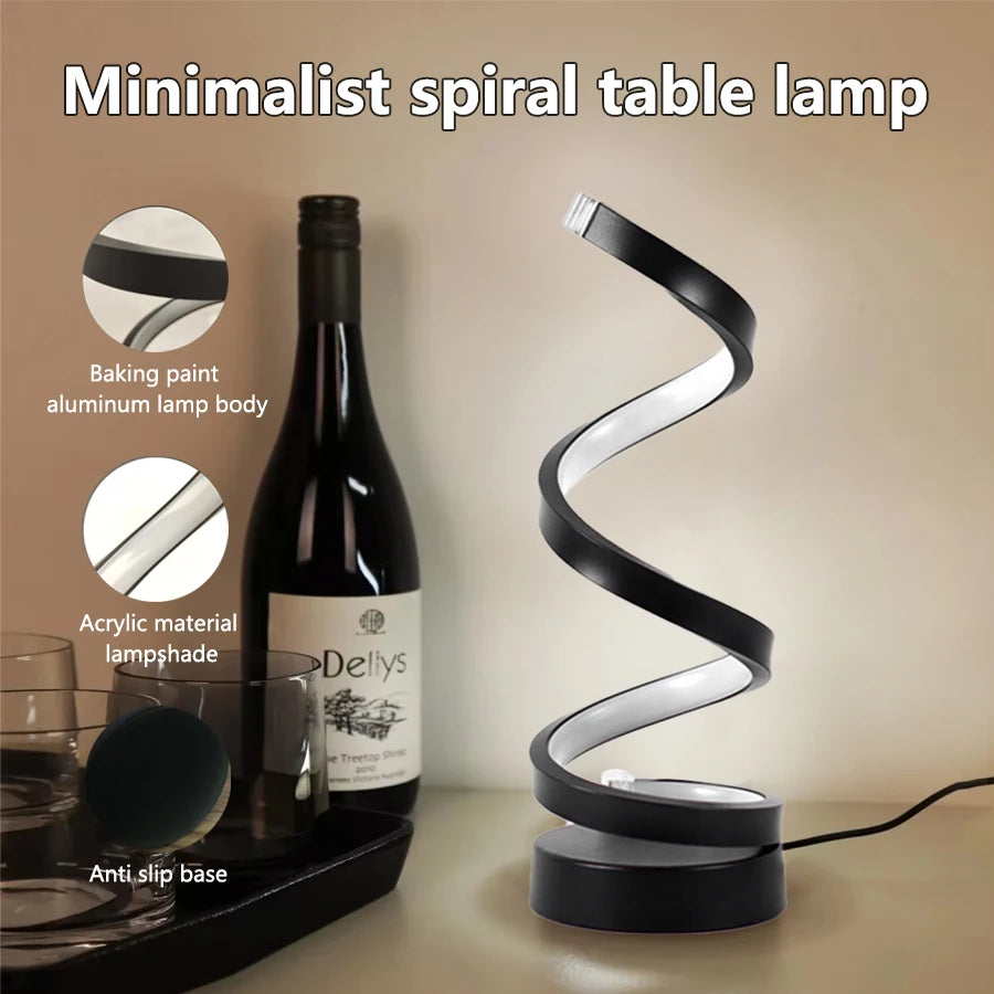 Clarify.pk spiral LED table lamp with minimalist black aluminum spiral design and acrylic lampshade on a table