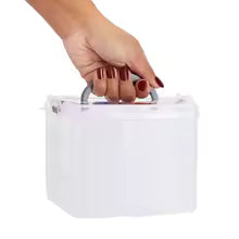 White stackable craft storage box with handle held by a hand for easy carrying