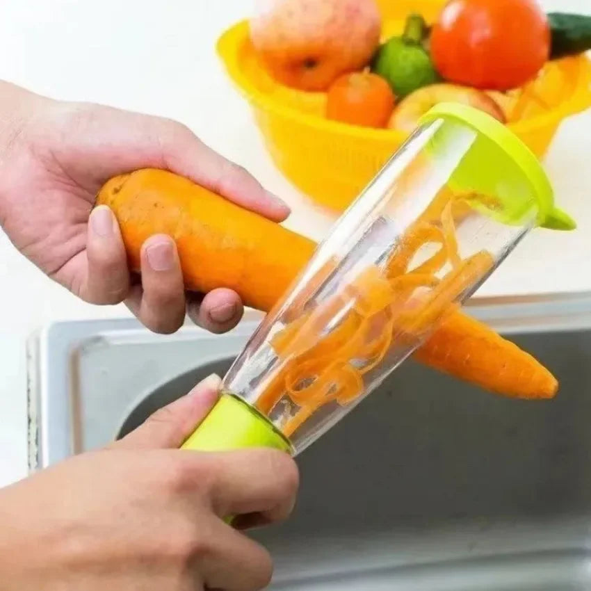 Stainless steel fruit peeler in use peeling a carrot with a transparent container for collecting peels