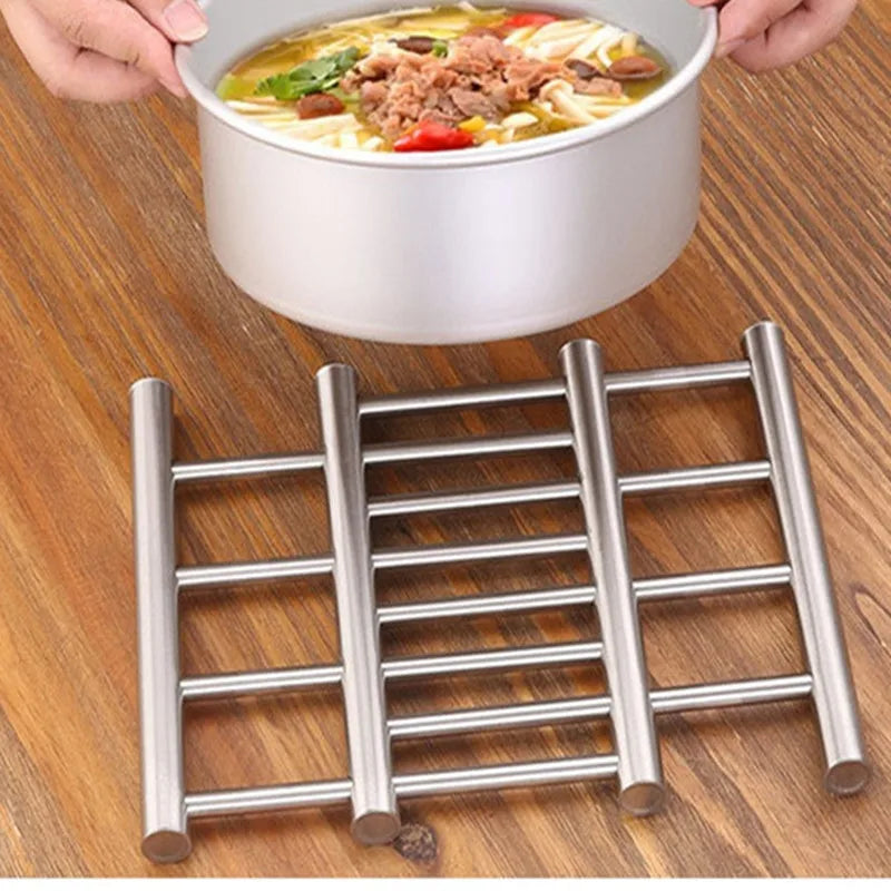 Clarify.pk stainless steel heat insulated rack on wooden surface holding hot soup pot