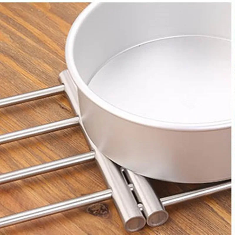 Clarify.pk stainless steel heat insulated rack protecting wooden surface from hot cookware