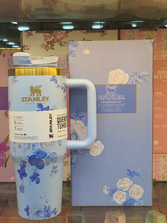 Stanley blue floral tumbler with handle and matching floral packaging by Clarify.pk