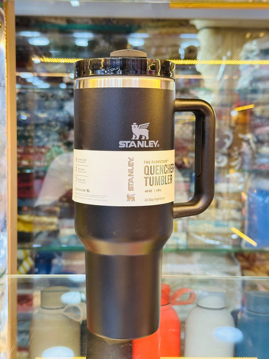 Stanley quencher tumbler in black with handle and lid for insulated beverage holding