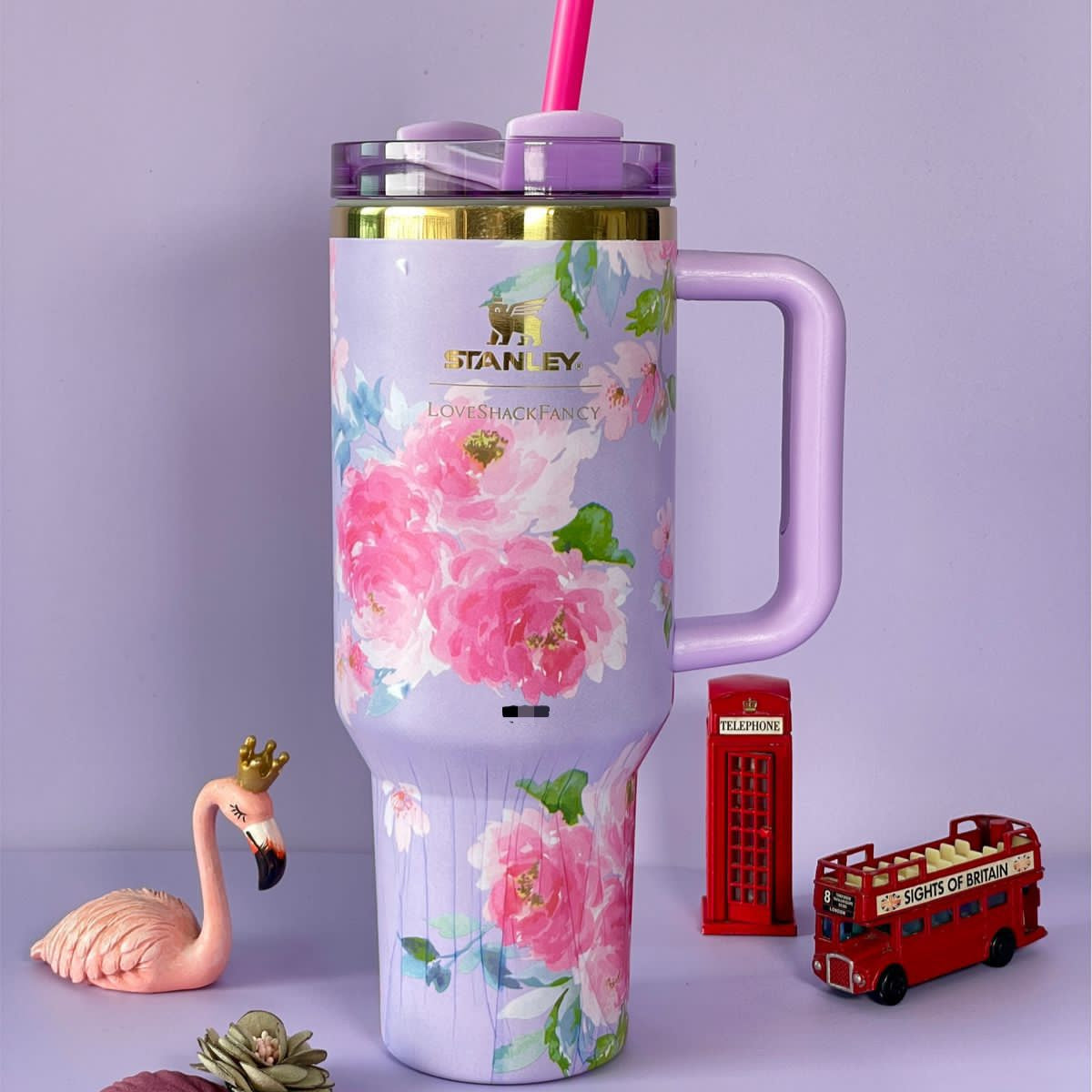Purple stainless steel flower tumbler with pink floral design and a handle by Clarify.pk