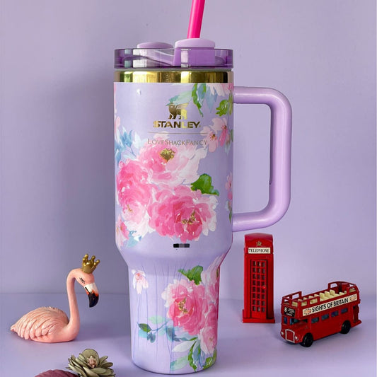 Purple stainless steel flower tumbler with pink floral design and a handle by Clarify.pk