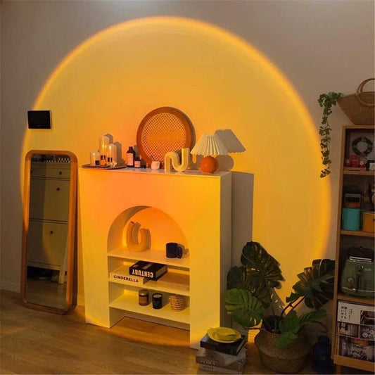 Warm orange glow from sunset projector lamp for bedroom illuminating cozy modern shelf and plants
