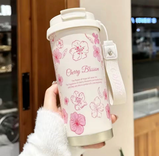 500ml stainless steel thermal flask with cherry blossom design and white strap for easy carrying