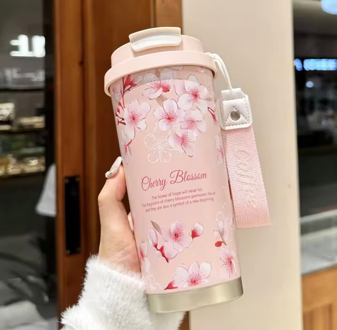 Clarify.pk 500ml stainless steel thermal flask with pink cherry blossom design and carrying strap