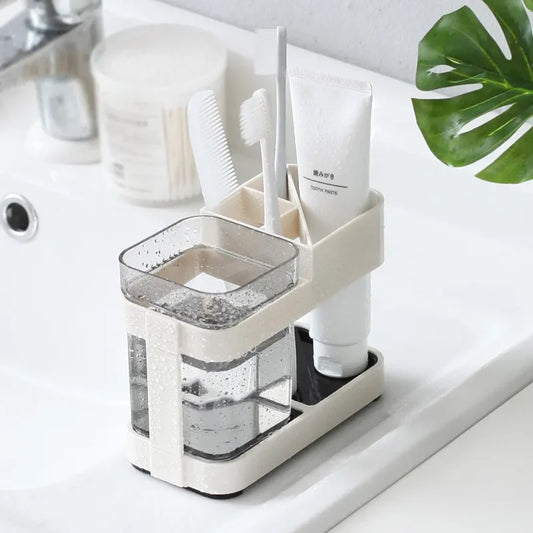 Clarify.pk floor type toothbrush organizer with compartments for toothpaste, toothbrush, and comb on bathroom sink