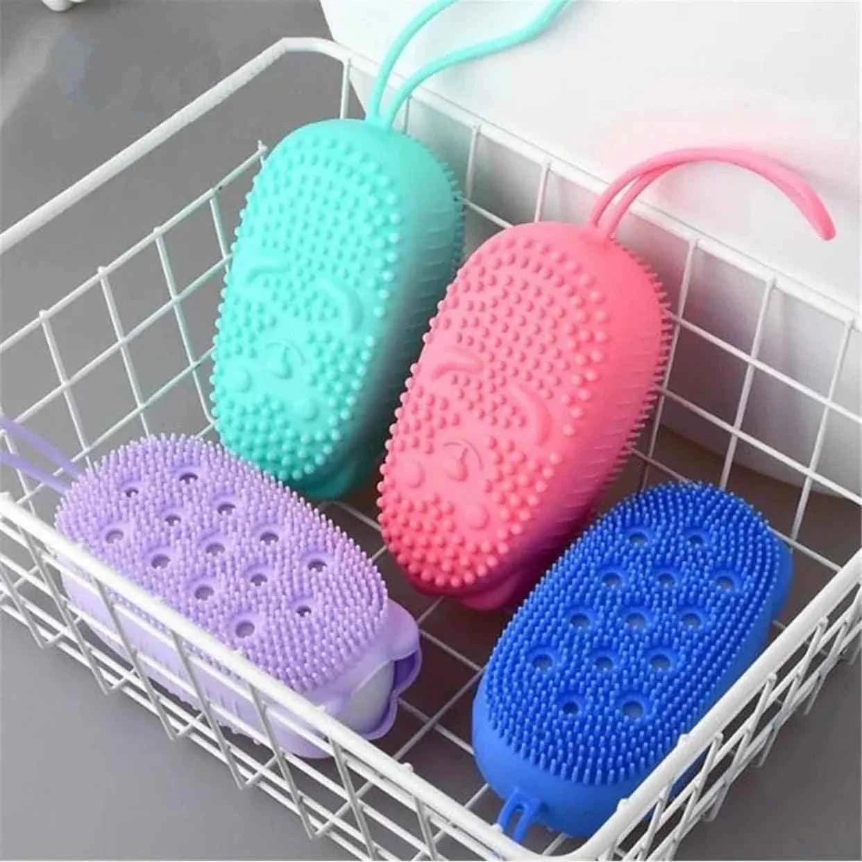 Clarify double sided bubble brush in pink blue green and purple silicone with flexible handles in a white wire basket