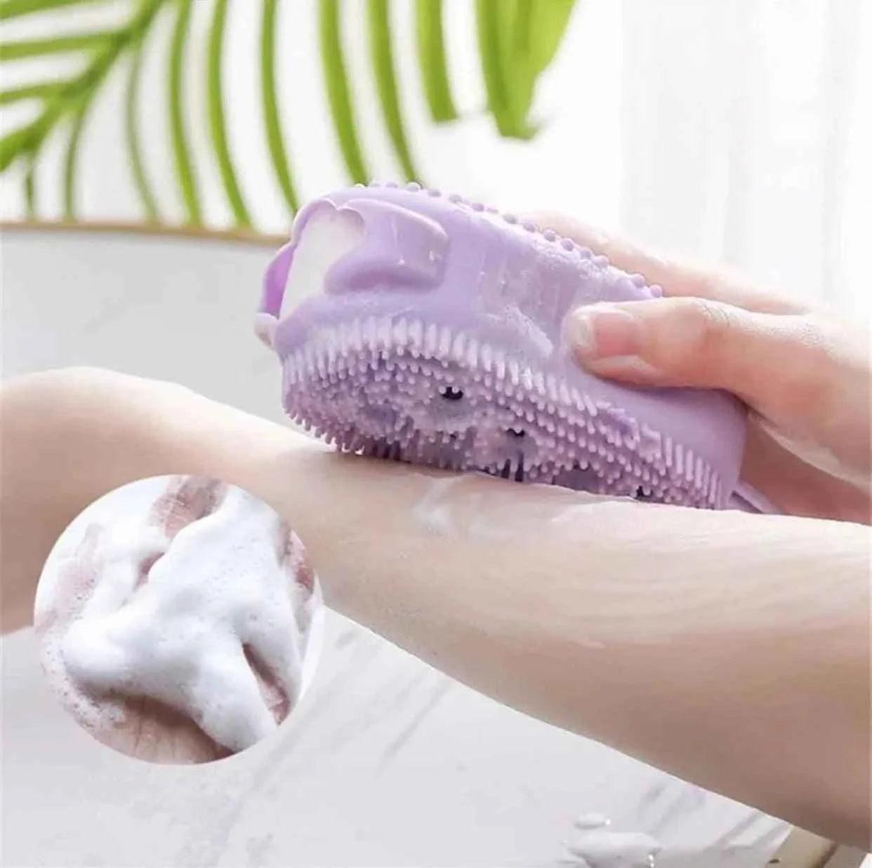 Clarify double sided bubble brush in lavender used for lathering and exfoliating skin on arm