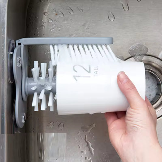 Clarify.pk sink bottle cleaning brush mounted in sink with hand cleaning white cup