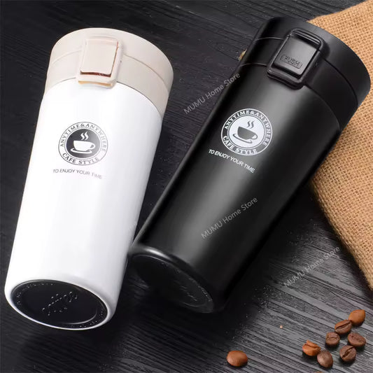 Clarify.pk vacuum insulated coffee thermos flask duo in black and white with secure lids on dark wooden surface