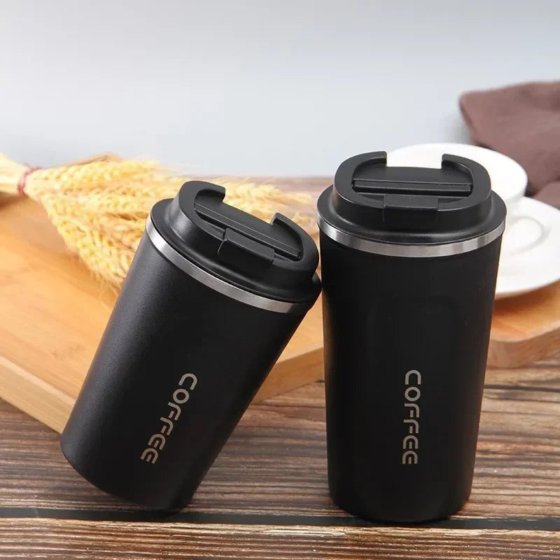 Clarify.pk black vacuum thermos bottle for tea and coffee with secure lids on wooden table