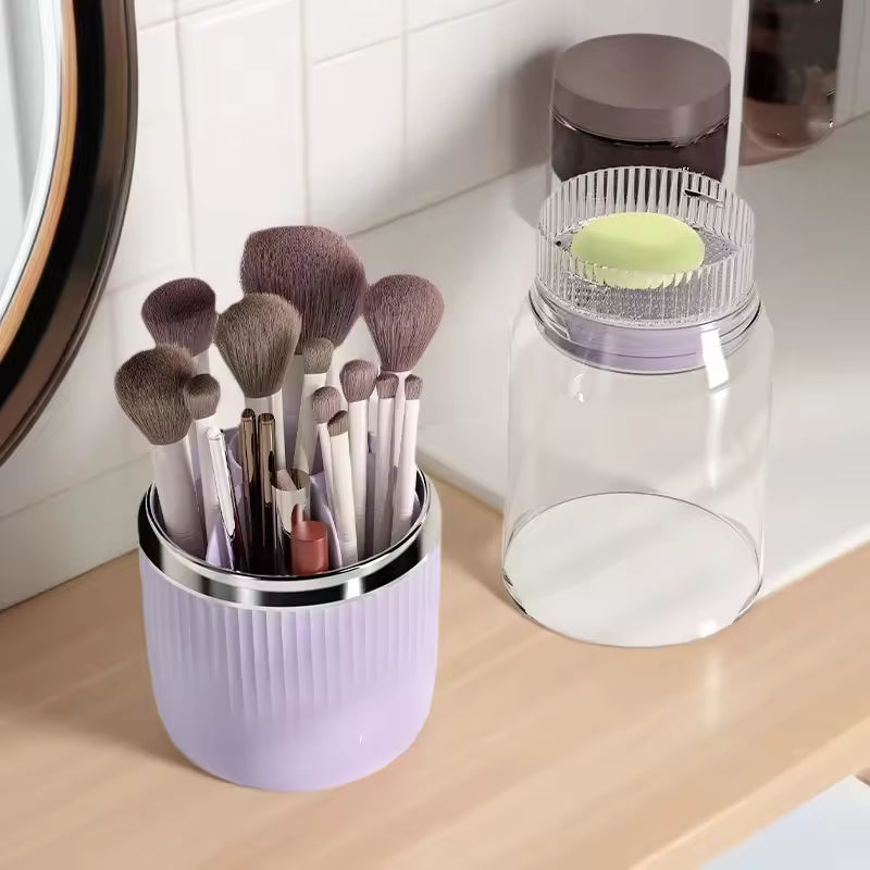 Clarify.pk brushes stored in a lavender container on a wooden surface with a transparent 360 degree makeup organizer nearby