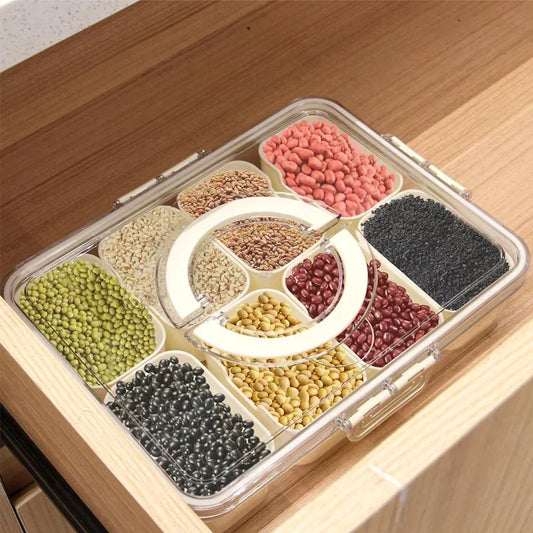 Clear 8 compartments snack container filled with various dry beans and seeds on a wooden surface