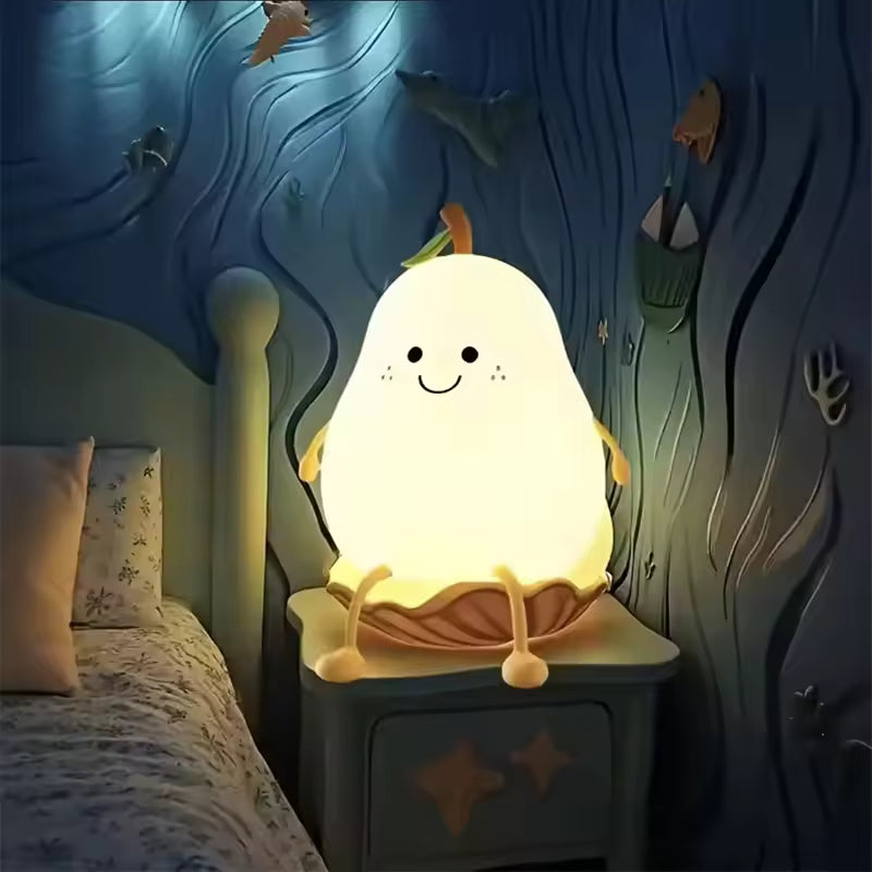 Cute pear night light glowing warmly on a bedside table next to a bed in a cozy room