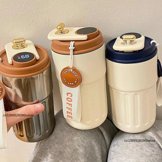 Clarify.pk premium coffee mug set with temperature display and secure lids in cream and metallic colors