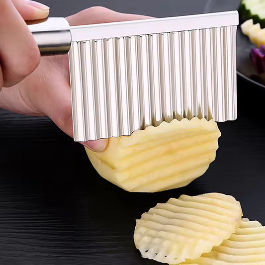 Clarify.pk stainless steel wavy potato cutter slicing a potato with wavy ridges for uniform cuts