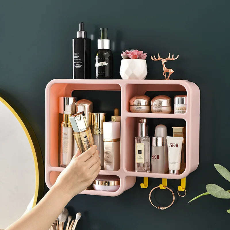 Pink wall mounted cosmetic organizer by Clarify.pk with multiple compartments holding skincare and makeup products