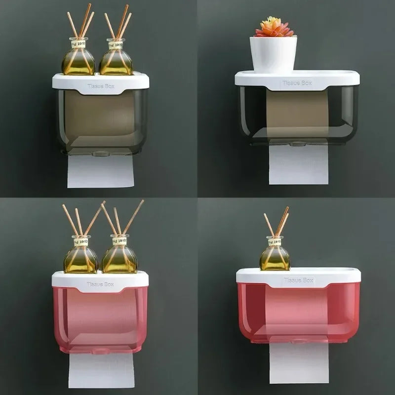 Wall mounted toilet paper holder with storage box in black and red, featuring decorative items on top