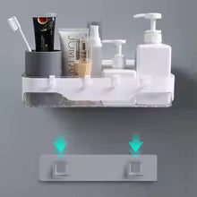 Wall-mounted bathroom shelf holding toiletries and pump bottles with strong adhesive hooks