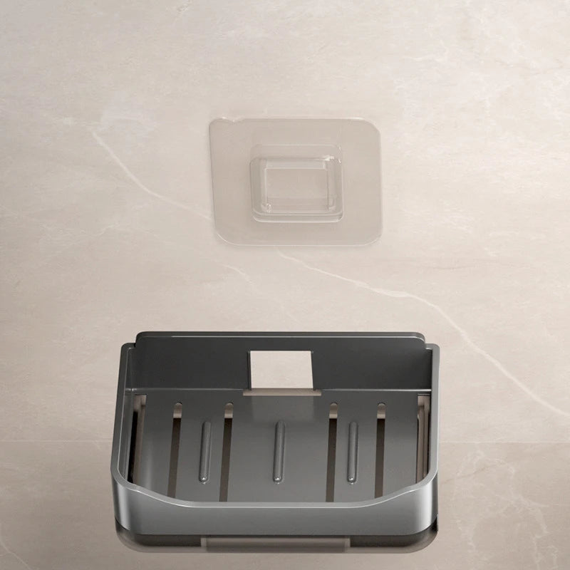 Clarify.pk wall mounted soap holder in metallic finish attached to a beige tiled wall