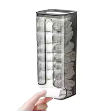 Wall mounted sock organizer with transparent compartments holding multiple pairs of white socks