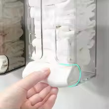Close-up of hand using wall mounted sock organizer with clear compartments for easy sock storage