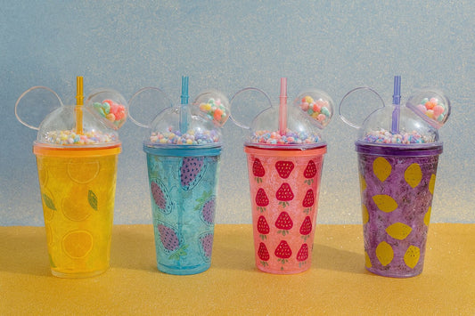 Colorful water bottles with fruit designs and clear dome lids with straws and candy inside
