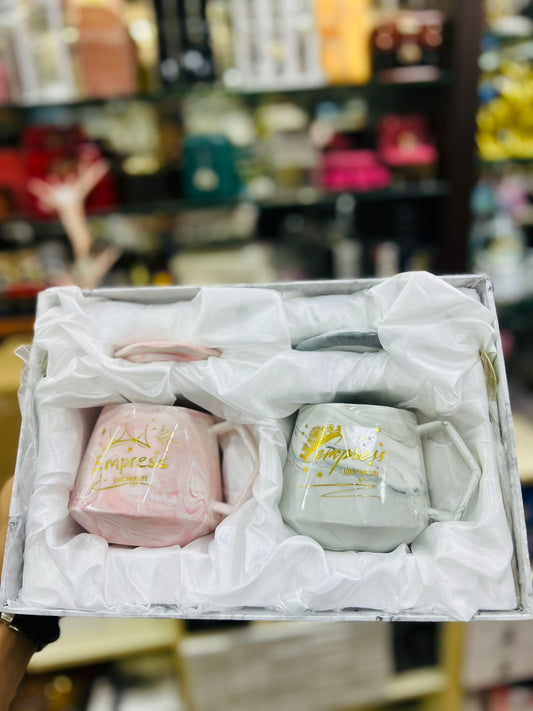 Set of white and pink ceramic mugs with gold lettering in a cushioned gift box from Clarify.pk