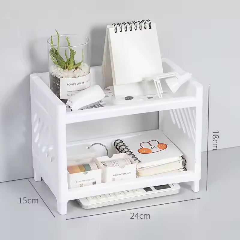White double layer desk organizer with office supplies and plant on a gray background