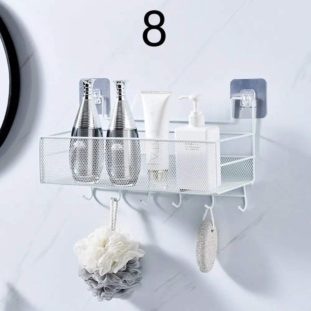 White metal mesh wall mounted bathroom shelf with hooks holding toiletries and bath accessories