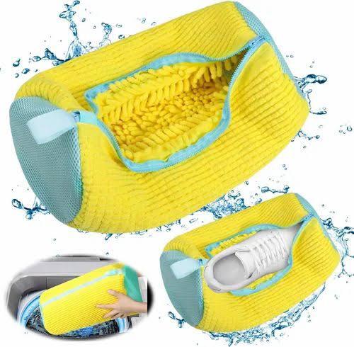Yellow and blue shoe washing pouch for washing machine with textured interior protecting white sneakers