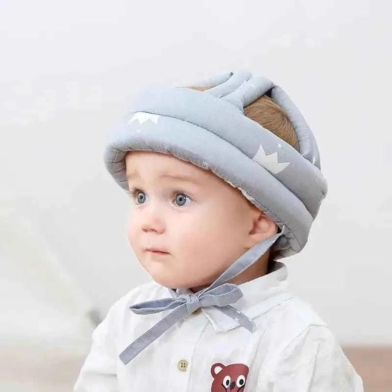 Baby wearing soft protective headgear for safe and comfortable Baby Care essentials