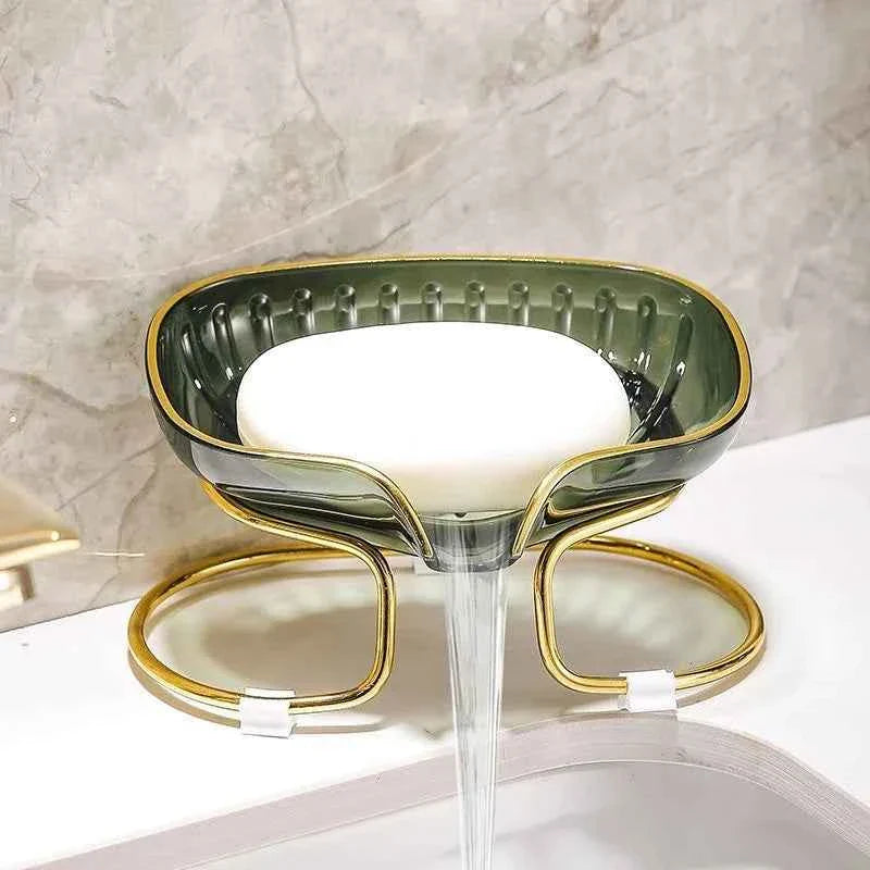 Stylish bathroom accessories soap dish with a white soap bar on a marble countertop