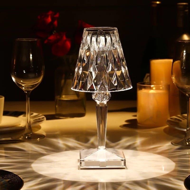 Elegant 16 colors diamond lamp made of clear crystal glass on a table with ambient lighting