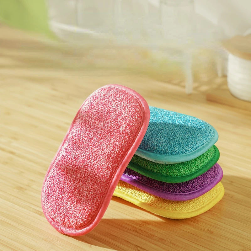 2 pieces double sided kitchen cleaning sponges in red, blue, green, purple, and yellow stacked on a wooden surface
