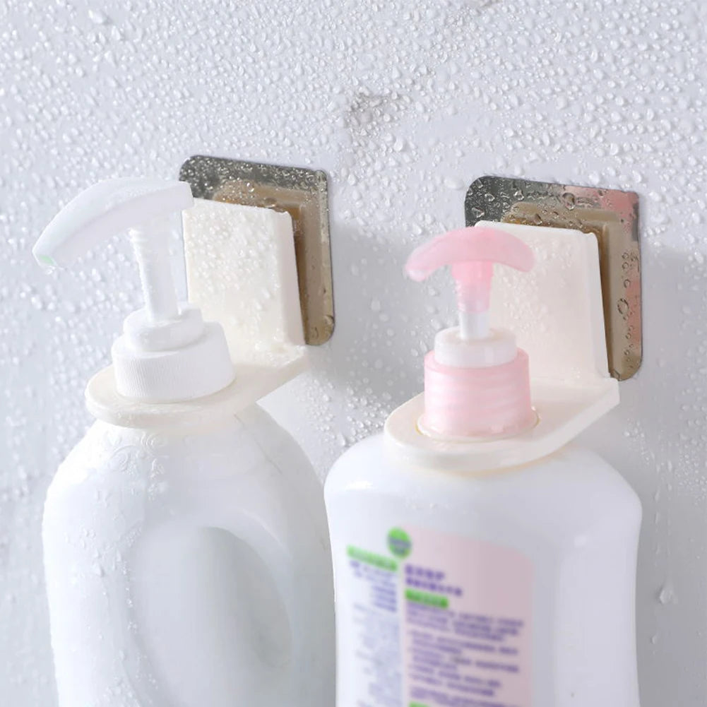 2 pieces wall mounted shampoo holder by Clarify.pk holding two white pump bottles on wet bathroom wall