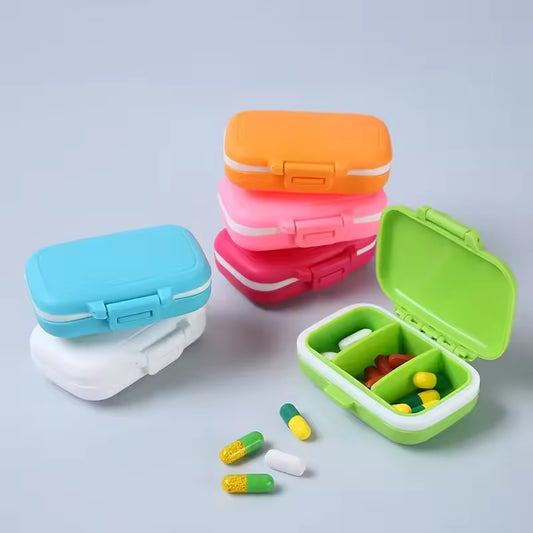 Colorful 3 compartment pill box by Clarify.pk with secure latch and multiple pills inside and outside