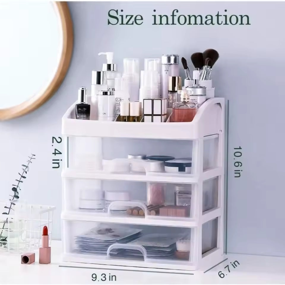 White 3 layer cosmetic storage case with clear drawers holding makeup bottles and brushes