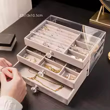 3 layer jewelry organizer with clear acrylic top and multiple compartments for rings and necklaces