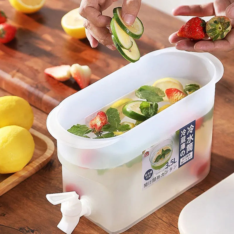 Clarify.pk 3.5l refrigerator water dispenser with spout holding fresh lemon, strawberry, and cucumber infused water